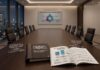 Proofpoint alerta sobre el auge del ransomware impulsado por inteligencia artificial Fotografía de una sala de juntas donde se exhibe sobre la mesa el Reporte sobre Ransomware en la Era de la IA 2026. El documento impreso y abierto detalla métricas sobre el incremento en la efectividad de las amenazas, acompañado de placas de acrílico con citas de ejecutivos y una pantalla al fondo que ilustra una estrategia de ciberseguridad centrada en las personas.
