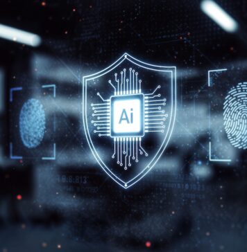 Sophos y OpenAI llevan la IA avanzada al canal para reforzar la ciberseguridad Ilustración digital de un escudo holográfico luminoso con un microchip y las letras "Ai" en el centro, flanqueado por íconos de escaneo de huellas dactilares y flujos de datos sobre un fondo oscuro de aspecto tecnológico.