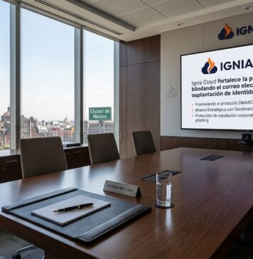 Ignia Cloud y Sendmarc se unen para blindar el correo corporativo frente al phishing Fotografía de una sala de juntas corporativa iluminada con vista hacia la Catedral Metropolitana de la Ciudad de México a través de un ventanal panorámico. En el centro de la mesa de madera pulida se observa una carpeta de piel con pluma de ejecutivo y una placa con el nombre "Esteban Rey - CEO". Al fondo, sobre una pared de madera, destaca una pantalla gigante con el logotipo de Ignia Cloud proyectando puntos clave sobre la protección del correo electrónico contra la suplantación de identidad.