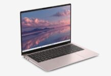 Dell lanza en América Latina el nuevo Dell 14S: movilidad, pantalla 16:10 y diseño premium Fotografía de producto en perspectiva de tres cuartos de la laptop Dell 14S abierta, mostrando su chasis metálico en tono rosado, un teclado negro empotrado y una pantalla en formato 16:10 que exhibe un paisaje de atardecer reflectante en tonos rosados y púrpuras.
