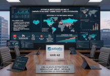 Palo Alto Networks detecta una masiva campaña de malware en YouTube dirigida a gamers y redes corporativas Fotografía en perspectiva de una sala de juntas ejecutiva con vista a la ciudad a través de grandes ventanales. En el centro de la mesa de madera hay computadoras portátiles y una placa con el logotipo de Palo Alto Networks y Unit 42. Al fondo, un videowall gigante presenta el "Informe de Investigación de Unit 42: Campaña de Malware Gaming Ghost", exhibiendo mapas globales de amenazas, gráficos de flujo de ataque e infografías estadísticas sobre la ciberseguridad en YouTube.